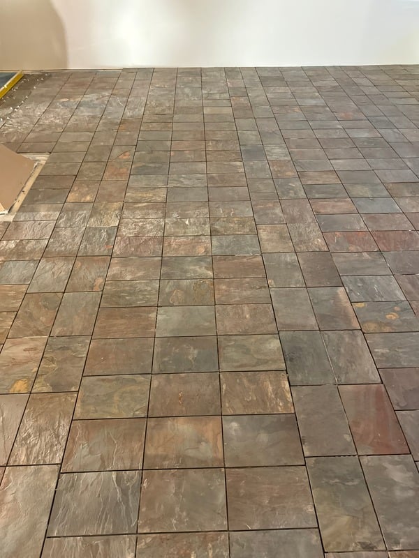 Wet-area tiling with matching wall and floor finishes