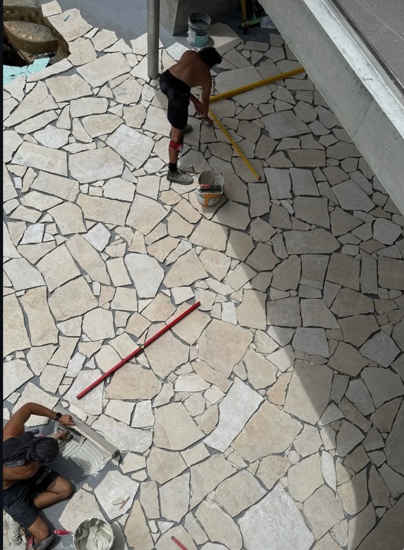 Completed tiling job showing straight joints and clean silicone lines